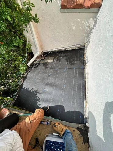 Roofing material laid out on a roof.