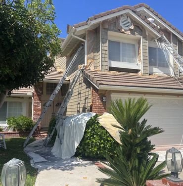 House exterior being prepared for a paint job.