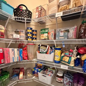 Snacks and dry goods organized in bins and on open, wire shelves