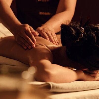 Person receiving a relaxing back massage.