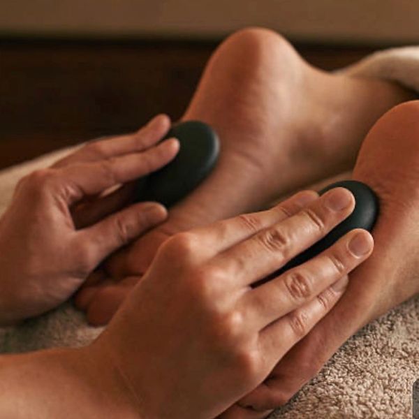 Hot stone massage on feet.