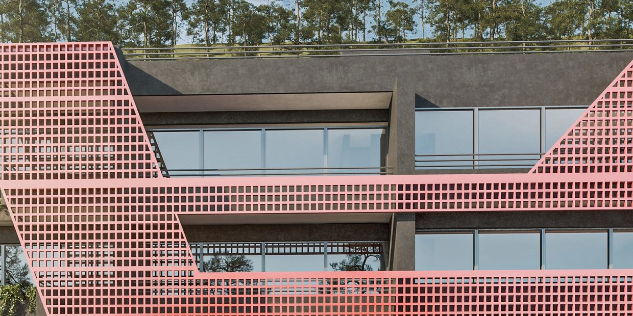 Modern building facade with pink lattice design and glass windows.