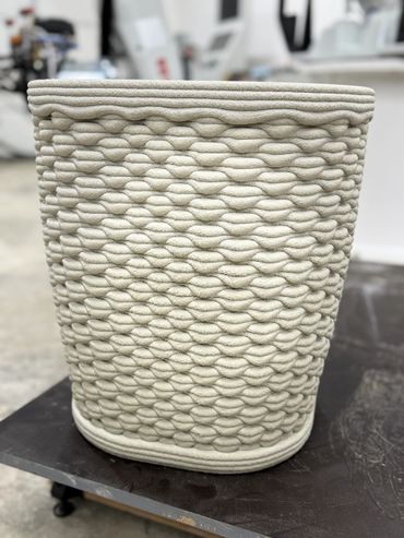 This flower pot has lip like shape to it.