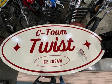 The main sign that hangs on the front of C-Town Twist.