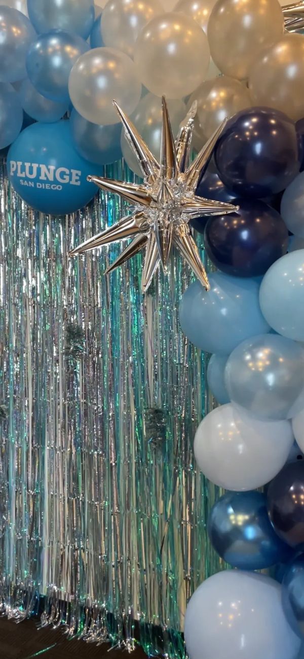 blue balloon arch and party backdrop