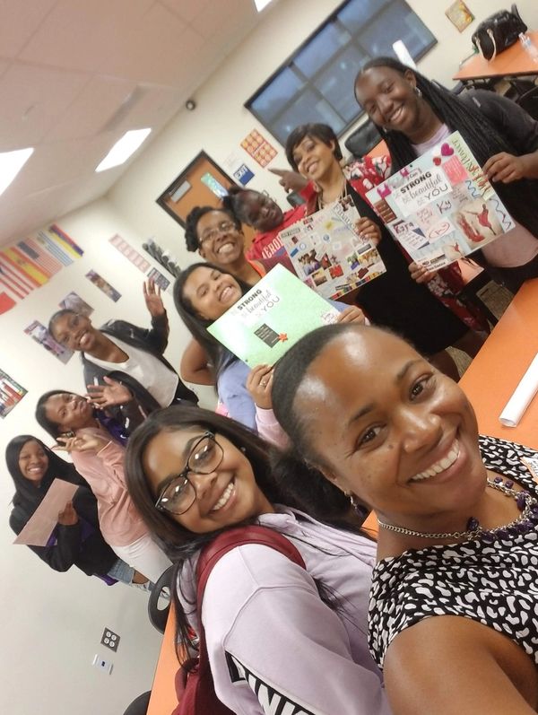 Mentor and mentees in on-campus mentorship club program on vision board day!
