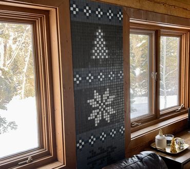 Mosaic mural with Nordic patterns on living room wall