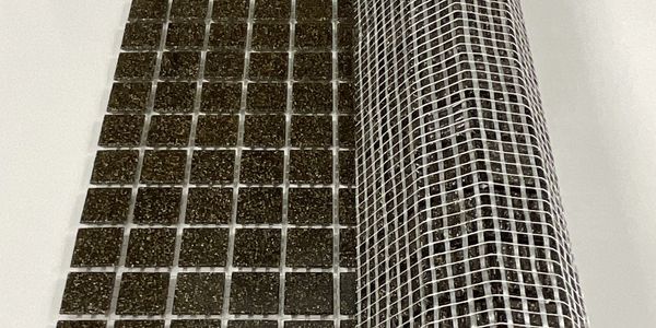 Partially rolled mosaic sheet on fiberglass mesh