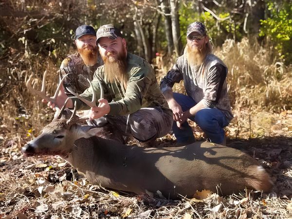 Travis Deck showing off his buck.