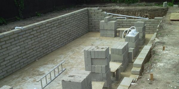 A swimming pool being under construction.