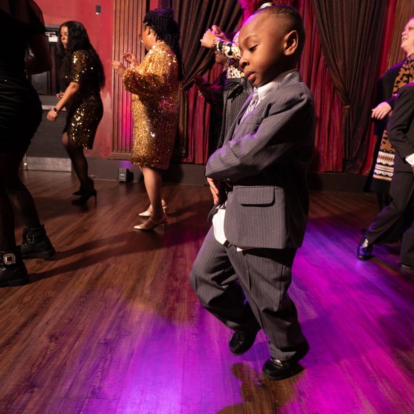 Young boy dancing at a party