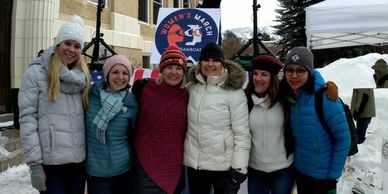 Group of women dressed warmly in winter.