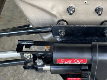 Close-up of a Flat Out rear steering system mounted on X3 Max.