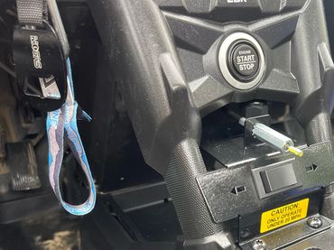 Interior view of vehicle center console with toggle switch dash for rear steering system.