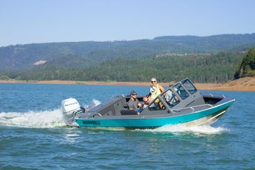 Four men in a Boulton aluminum powerboat on the water