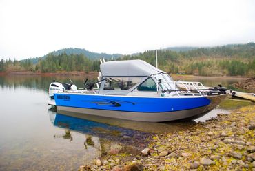 Boulton aluminum powerboat on the shore of a lake