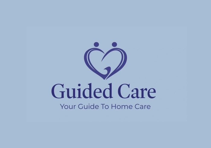 Logo of Guided Care featuring two figures forming a heart shape.