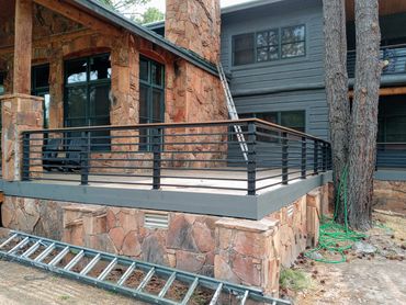Modern horizontal steel deck railing with wood cap rail, Flagstaff AZ