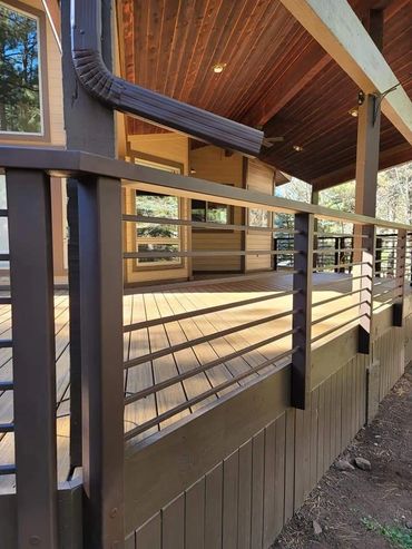 Horizontal fascia-mounted railing with oversized cap rail, BR-47 textured powder coat, Flagstaff AZ