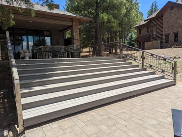 Steel stair railings with framed wire mesh panels in Flagstaff, Arizona.