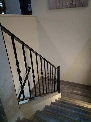 Decorative steel stair railings with twisted balusters for a Peoria home.