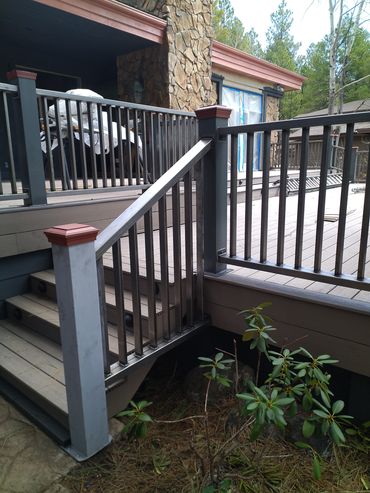 Steel stair and deck railings with vertical pickets for a Flagstaff mountain home