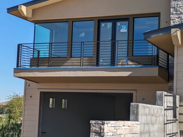 Custom modern horizontal iron deck railing.