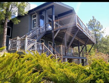 Custom steel stairs with steel mesh deck and stair railing.