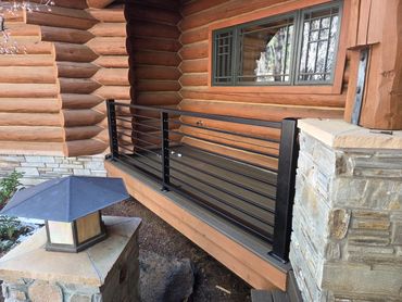 Modern horizontal steel deck railing with 4x4 posts, black powder coat, Flagstaff AZ
