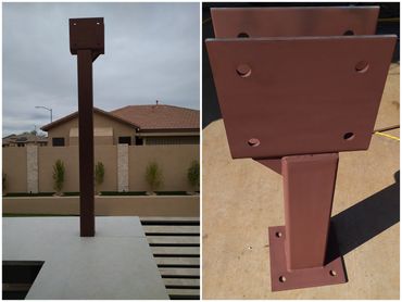 Custom structural steel support post with welded connection plates.