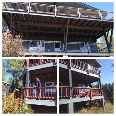 Custom steel deck extension with structural steel supports and modern steel stair railing.