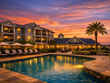 A beautiful resort pool at sunset.