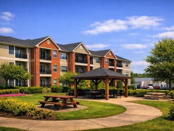 Apartment complex with picnic area and gazebo.