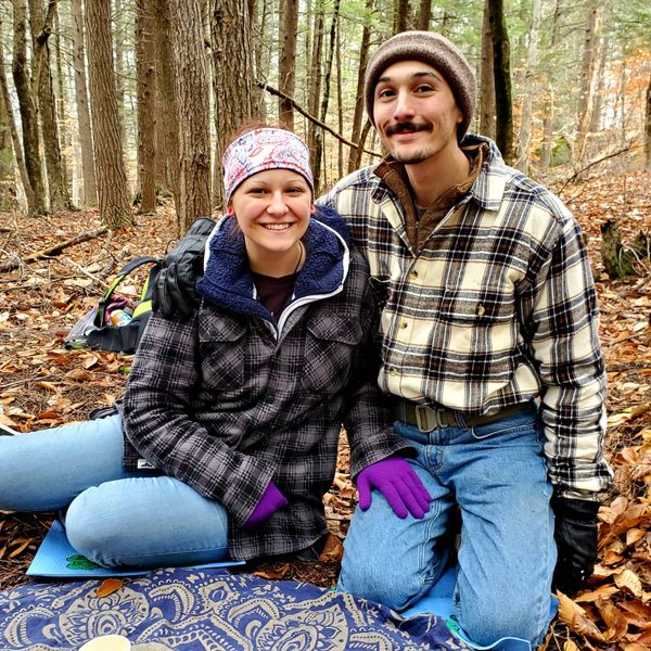 Happy couple enjoying forest bathing