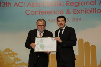 Mr Kjeld Binger, Chief Executive Officer of AIG receiving QAIA's carbon neutral award in Tokyo