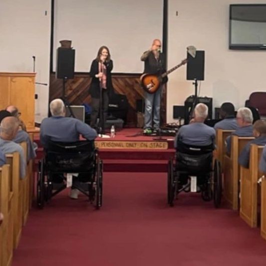 Boo Radley acoustic duo speaking with incarcerated men inside of a Florida prison