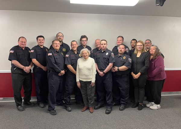 Fire fighters, line officers, and administrative officers with Mayor Betty Copeland. January 2024