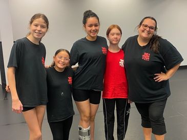 Group of dancers posing together in dance class in Milton