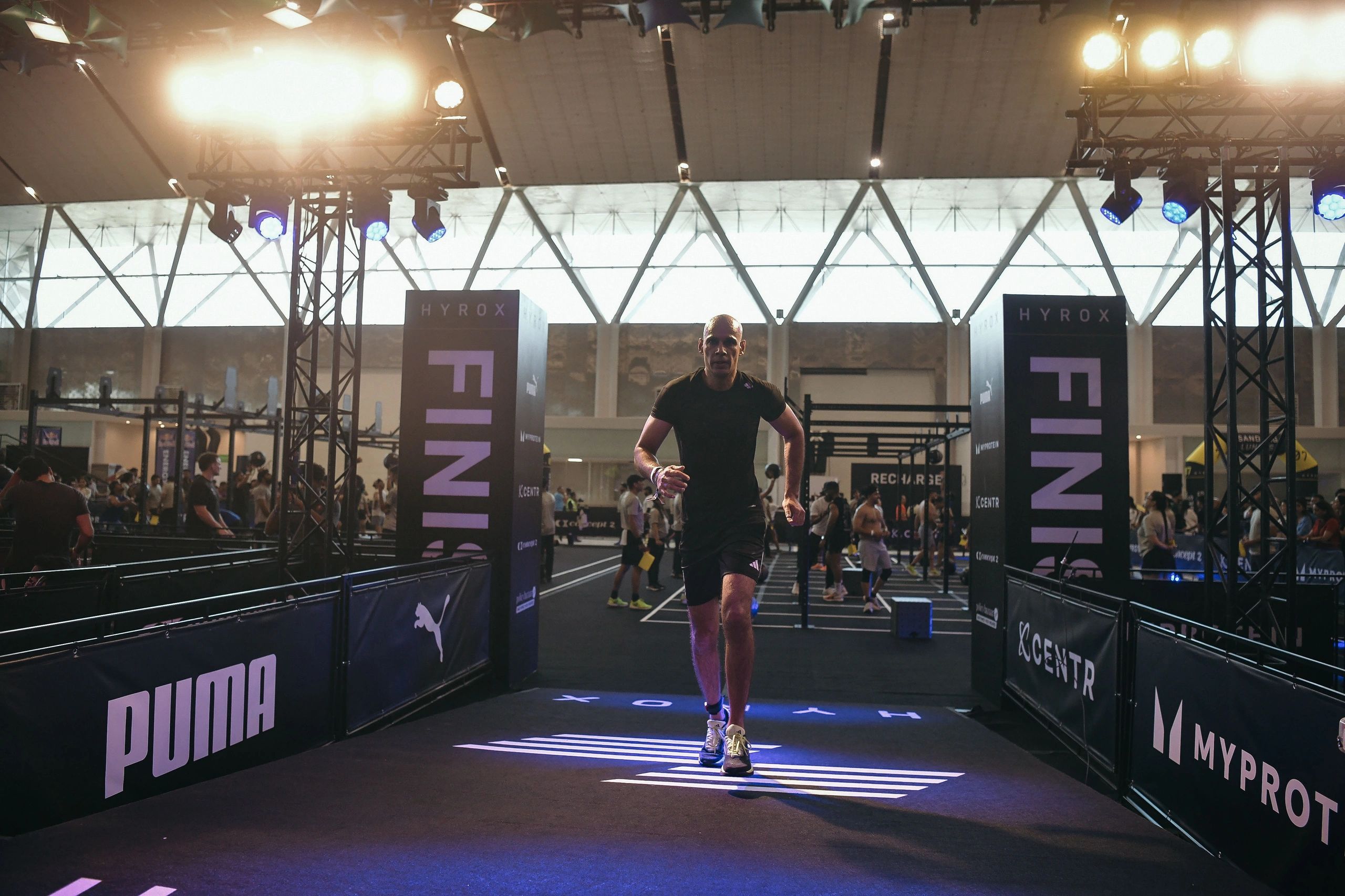 Online Fitness Trainer Manish Yadav completing the finish line of race event.