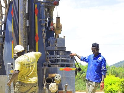 Borehole Drilling Team Installing Steel Casings