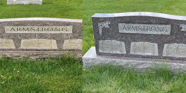Two Armstrong gravestones side by side in a cemetery.