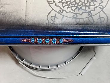 Mirror prepped off and in the process of painting with pearl flakes