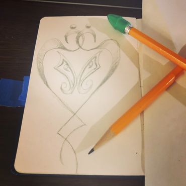 SketchBook with drawing and pencils