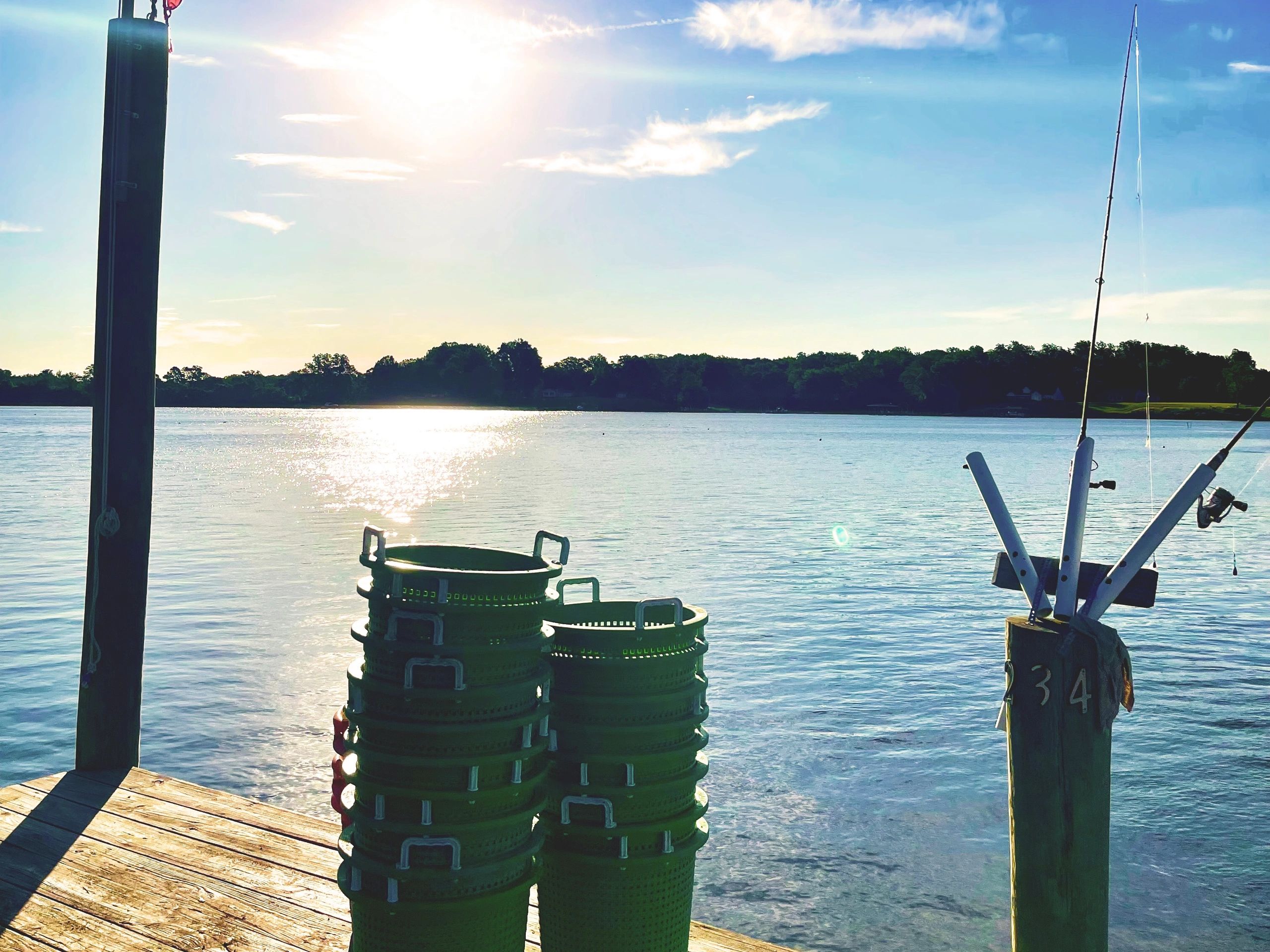 Oyster buckets on dock overlooking Nomini Bay Oyster Ranch