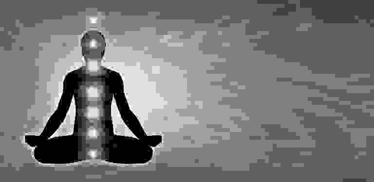 Chakra colors shown over the silhouette of a man.