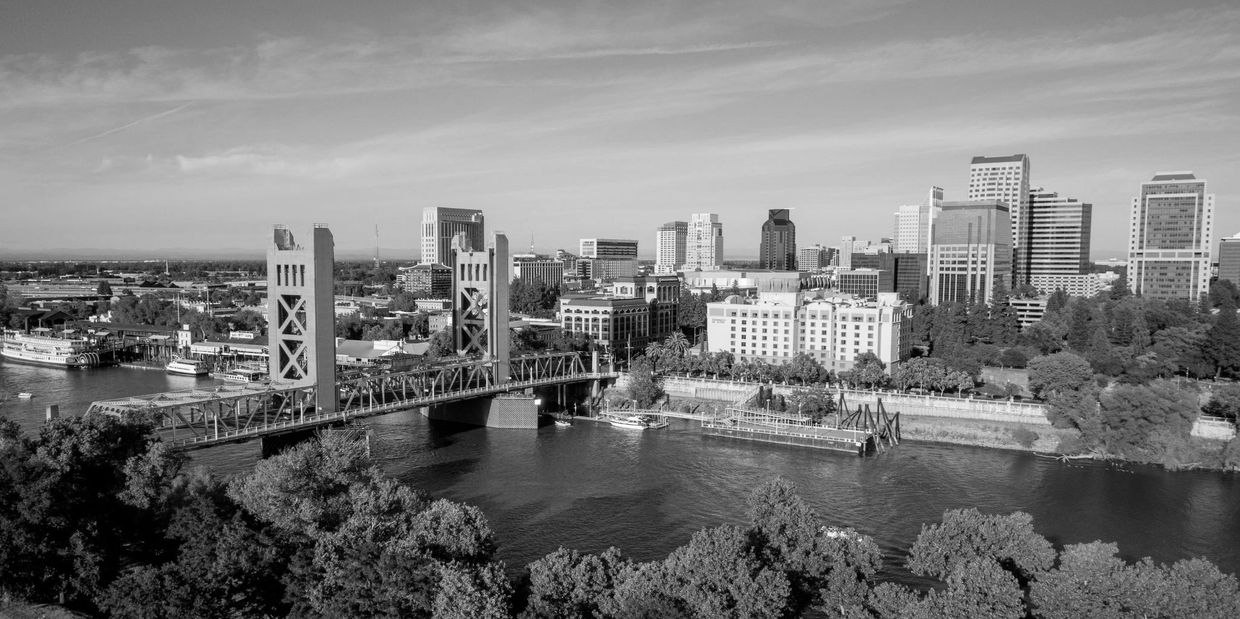 Aerial view photo of Sacramento's Tower Bridge and the Sacramento River, looking towards the Capital