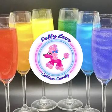 Colorful drinks in champagne flutes with Puffy Love Cotton Candy logo.