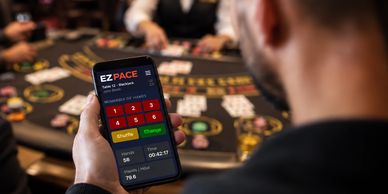 Person using EZ Pace app at a poker table.