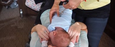chiropractic treatment with activator on baby