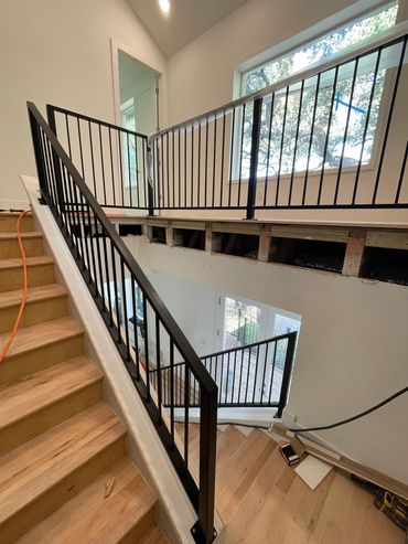 Custom Residential black stairwell handrail